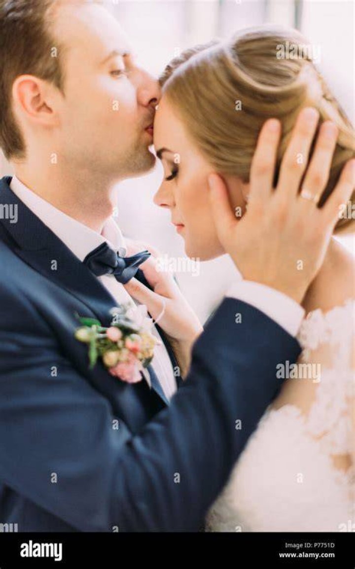 Close Up Portrait of Groom Kiss Bride in the Temple. Beautiful and