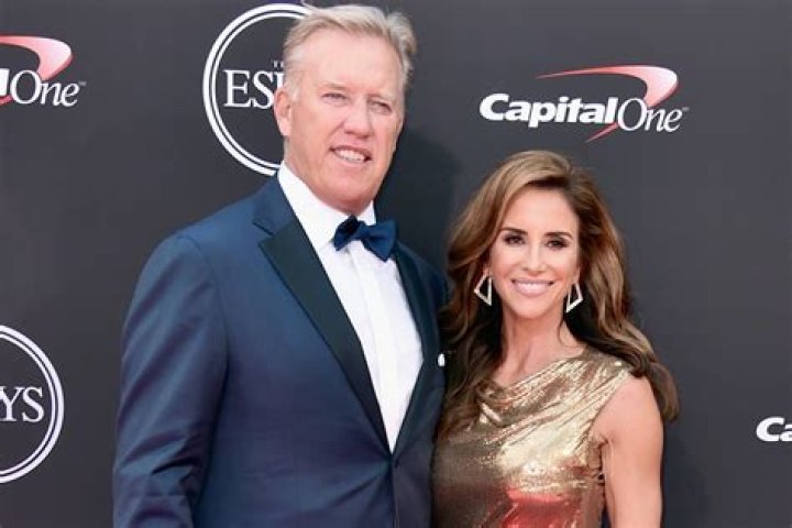 John Elway and his wife Paige at the Flight to Luxury Hangar Event 2012