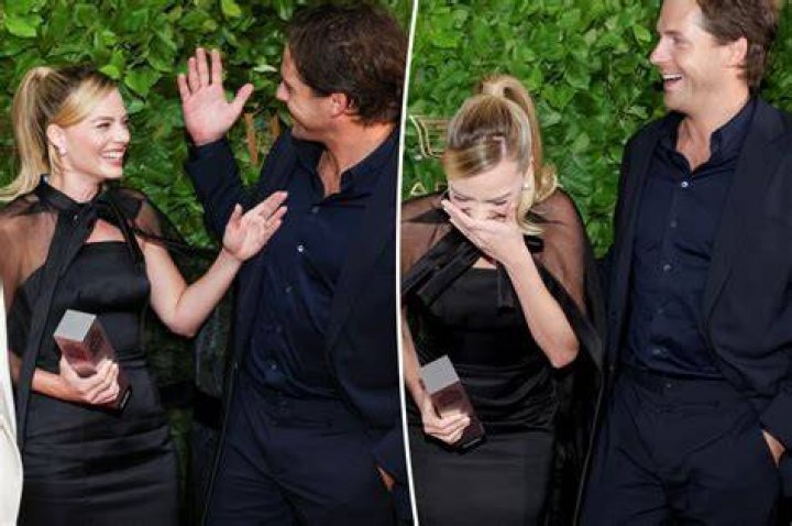 Margot Robbie laughs uncontrollably when husband Tom Ackerley pinches
