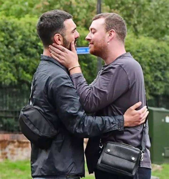 Sam Smith cuddles and snogs their new boyfriend in very passionate