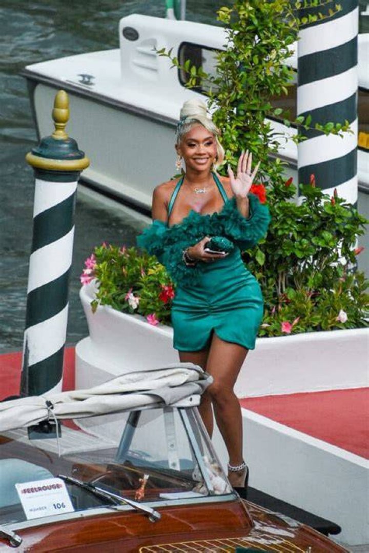 Saweetie dons Dolce & Gabbana and brings her father Johnny Harper as