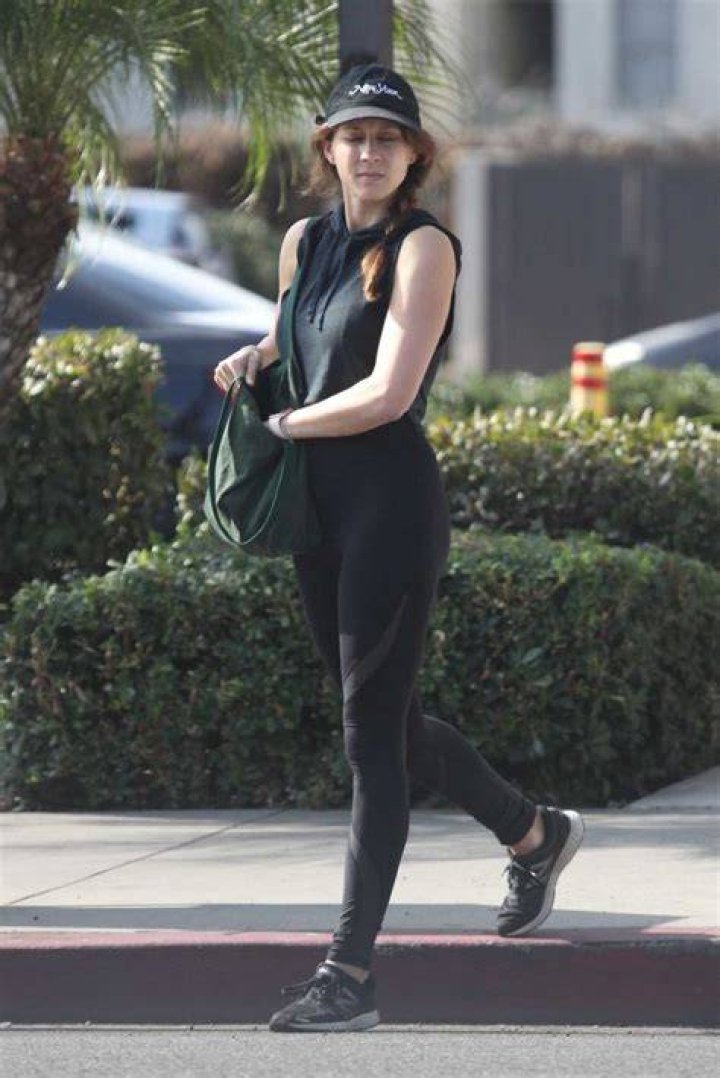 Troian Bellisario in Black Leggings Walks Out with Her Daughter and